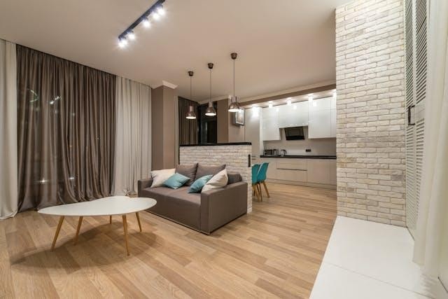 furnished living room with a table and couch